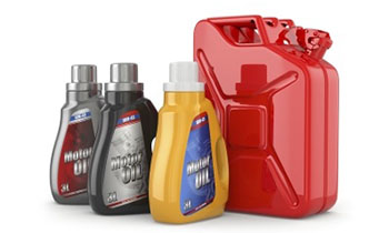 Various bottles of engine oil in different colours, next to a red fuel can.