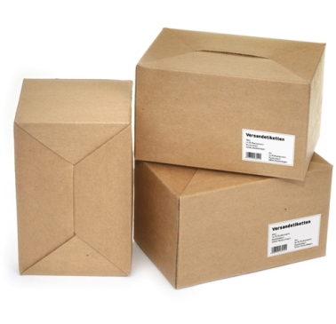 Three brown shipping boxes with labels, stacked on top of each other.