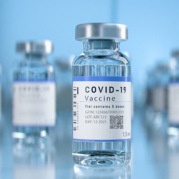 COVID-19 vaccine vial with a label indicating it contains 5 doses. Visible information on GTIN, lot number, and expiry date.
